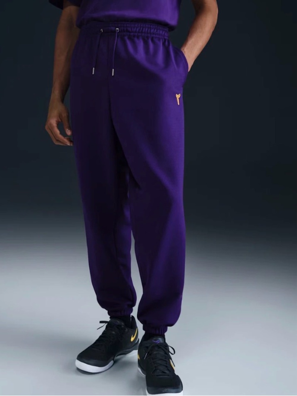 Nike Purple Jogger Sweatpants with Gold Swoosh Accent